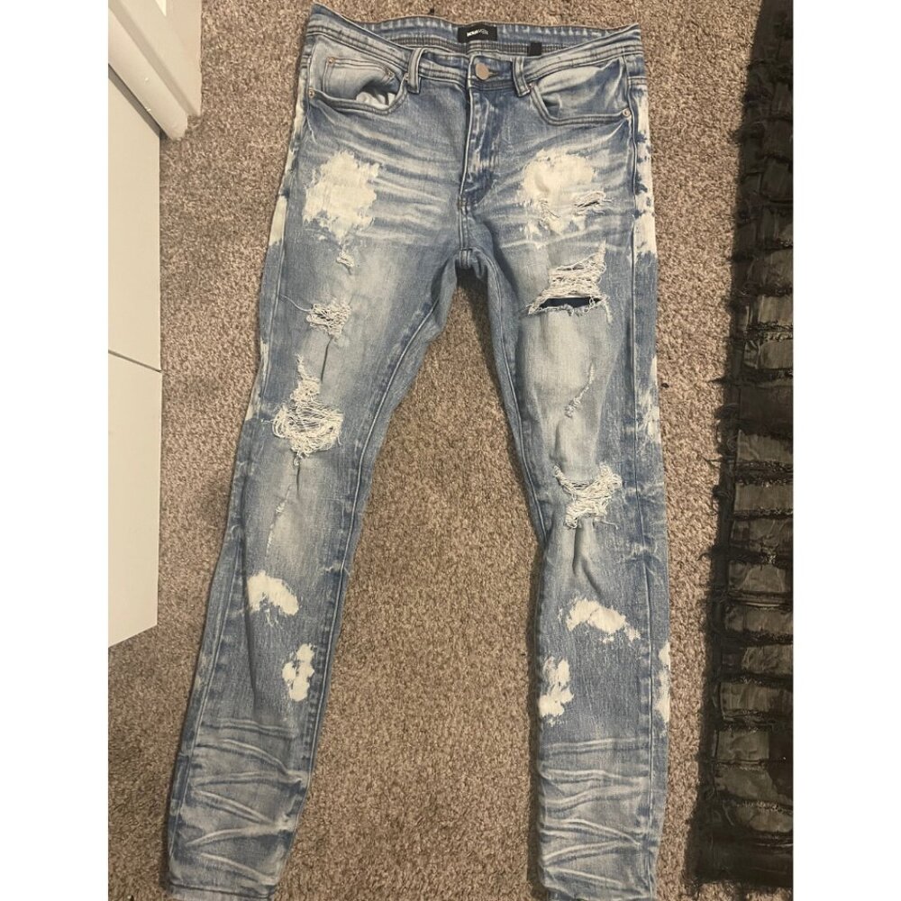 Distressed Blue Denim Jeans